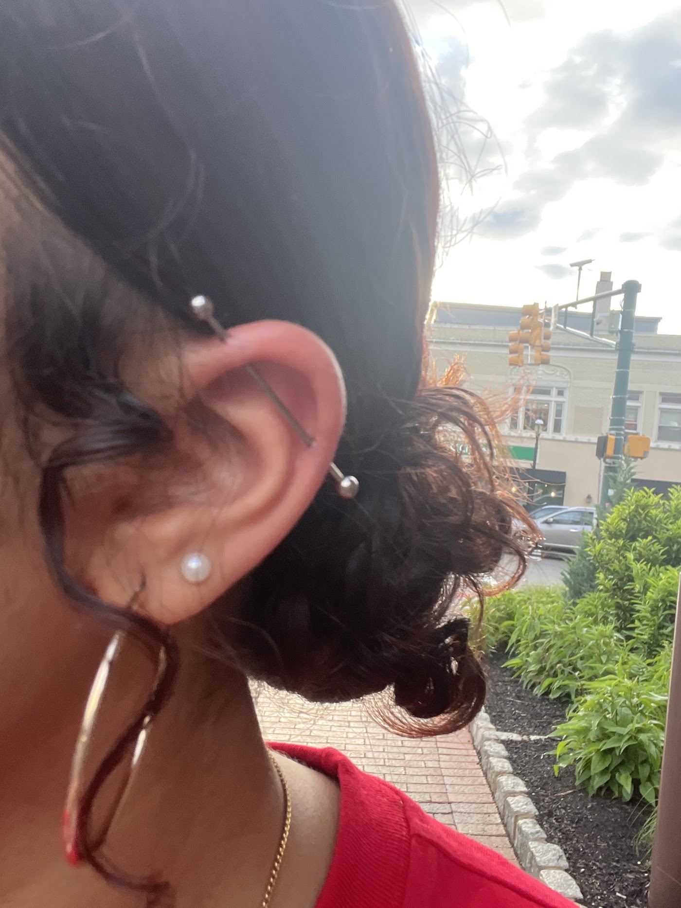 Industrial barbell ear piercing done at S.O.C.A. Tattoo Studio